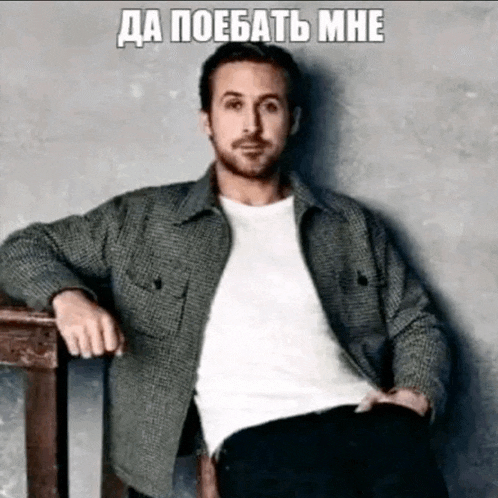 a man in a plaid jacket is sitting on a wooden chair with his hands on his hips .