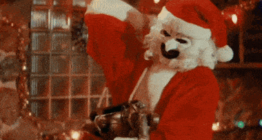 a man dressed as santa claus with a mask on