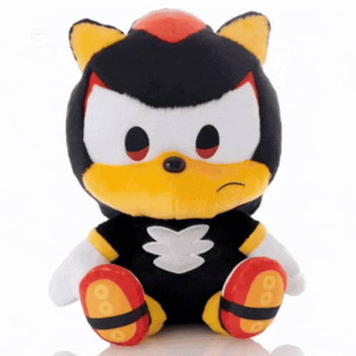 a stuffed shadow from sonic the hedgehog sitting on a table