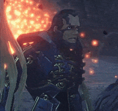 a man with a beard is standing in front of a red light