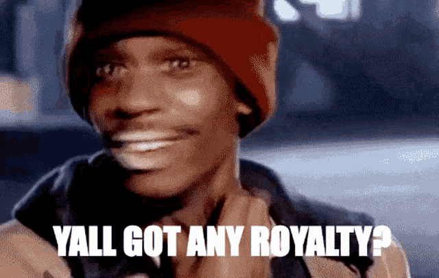 a man wearing a red hat is smiling and saying yall got any royalty