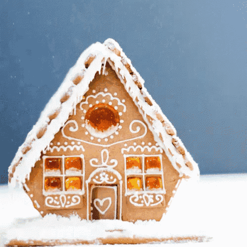 a gingerbread house with a heart on the door and windows