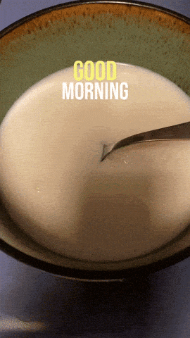 a bowl of soup with a spoon in it and the words good morning written on it