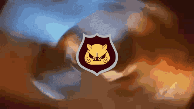 a shield with an angry pig on it against a blurry background