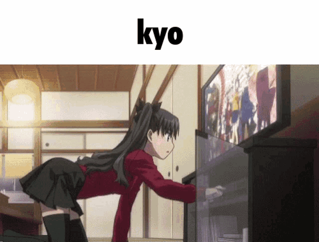 a picture of a girl looking at a television with the word kyo above her