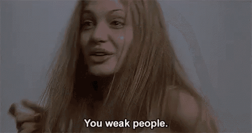 a woman with long hair is talking to someone and says `` you weak people '' .