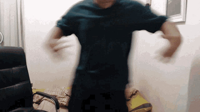 a blurry photo of a man in a green shirt
