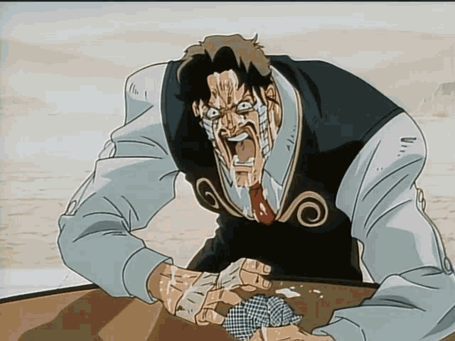a man with bandages on his face is holding a playing card in his hand