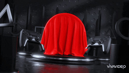 a red cloth is covering a video game controller in a room