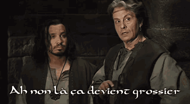 two men are standing next to each other with ah non la ca devient grossier written in white
