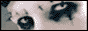 a close up of a person 's face with a shadow of a person behind them