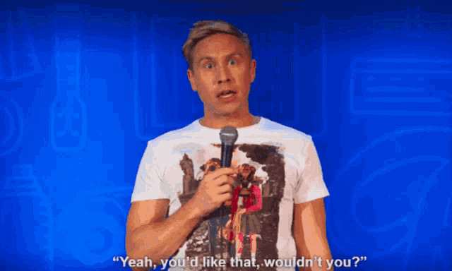 a man holding a microphone says " yeah you 'd like that would n't you "