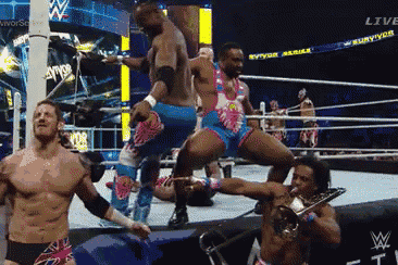 wrestlers in a wrestling ring with the word live on the bottom