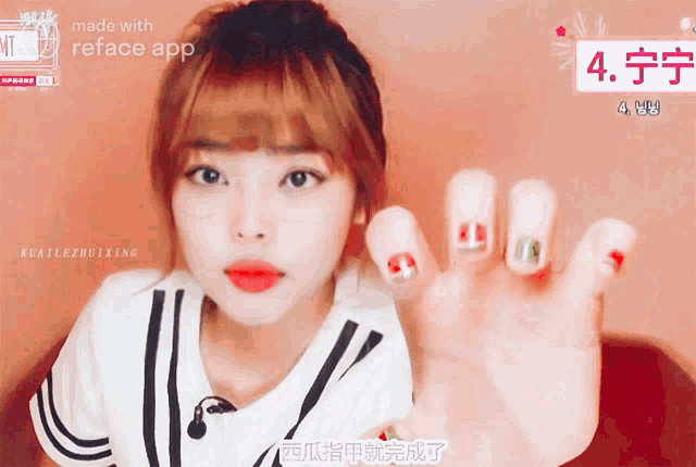 a girl shows off her nails and says made with reface app on the bottom