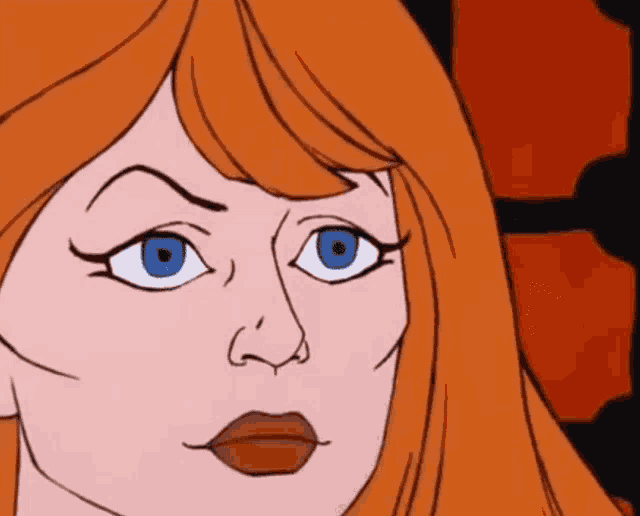 a close up of a woman 's face with blue eyes and red lips