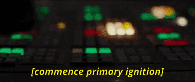 a close up of a person pressing a button with the words commence primary ignition