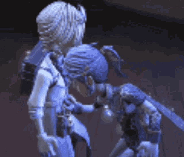 a couple of cartoon characters are standing next to each other on a stage .