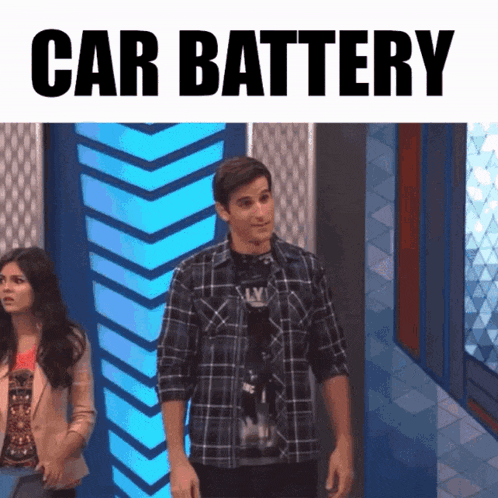 a man in a plaid shirt is standing in front of a blue wall with the words car battery written above him