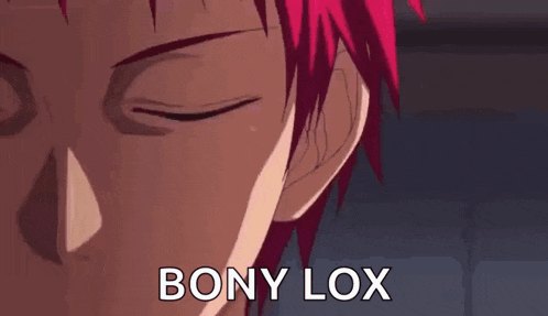 a close up of a person 's face with red hair and the words bony lox written on it .