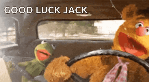kermit the frog and fozzie bear are driving a car with the words good luck jack written above them