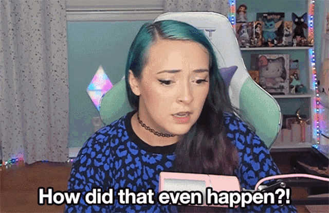 a woman with blue hair is sitting in a chair and asking how did that even happen ?