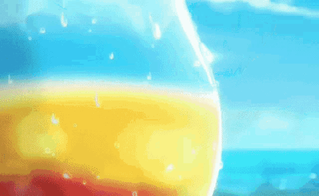 a close up of a person drinking a pineapple juice through a straw