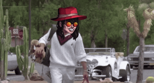 a woman in a red hat and sunglasses is walking down a street