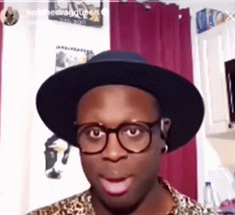 a man wearing glasses and a hat with the name bob on the bottom