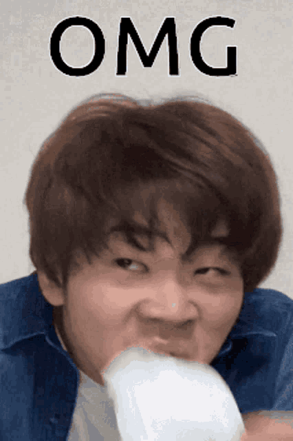 a close up of a person 's face with the word omg written above it