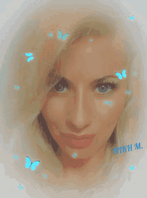 a woman 's face is surrounded by blue butterflies and the name misha m.
