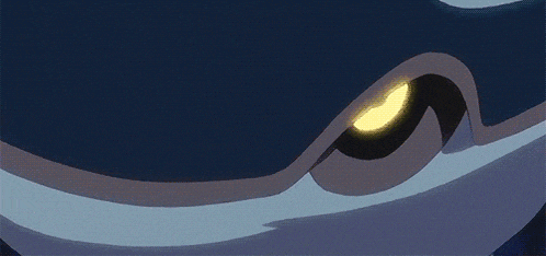 a close up of a cartoon character 's eye with bubbles around it