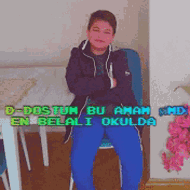 a boy is sitting in a chair with the words d-dostum bu aman en belali okulda on the bottom