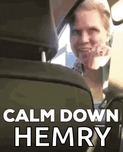 a woman is sitting in the back seat of a car with the words calm down hemry on the screen .