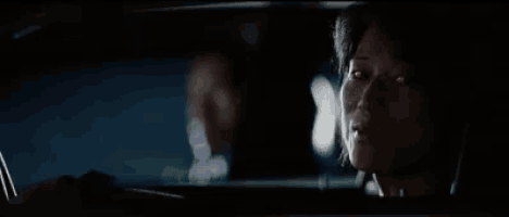a woman in a car with the words kita pasti menang