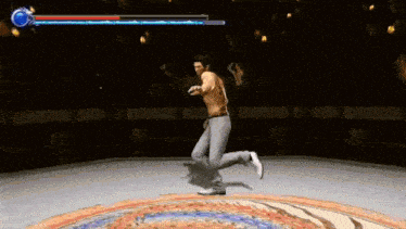 a man without a shirt is playing a video game .