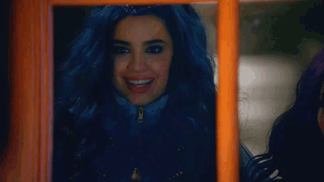 a woman with blue hair is looking out of a window .