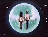 a man and a woman are standing in front of a full moon .