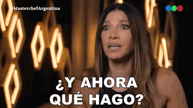 a woman says " y ahora que hago " in front of neon lights