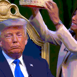 a man in a suit and tie is sitting in front of a woman holding a crown over his head