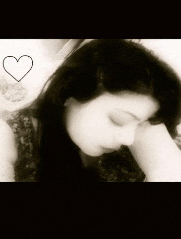a black and white photo of a woman with a heart in the corner
