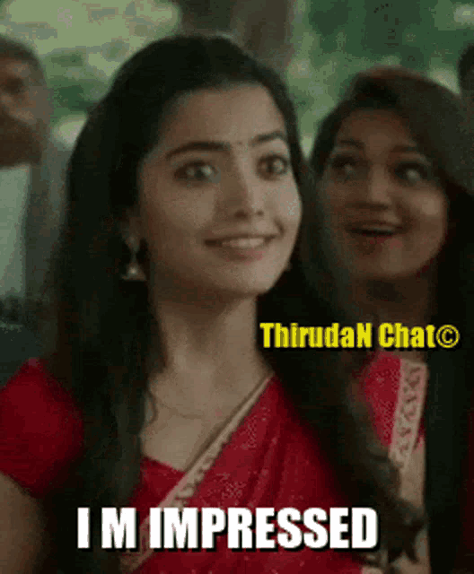a woman in a red dress with the words i 'm impressed on the bottom
