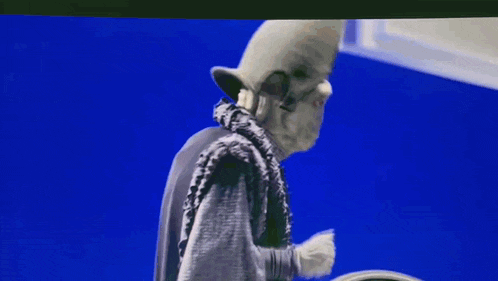 a statue of a man with a hat on a blue background
