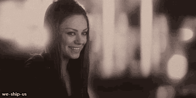 a black and white photo of a smiling woman with the words we-ship-us on the bottom