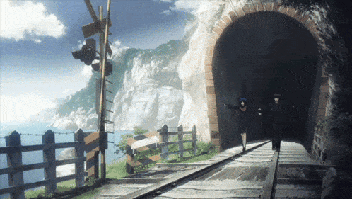 a man and a girl are walking through a train tunnel