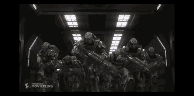 a group of soldiers are standing in a dark room with the word movieclips on the bottom right corner