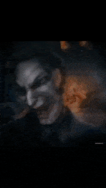 a person 's face is surrounded by a glowing light