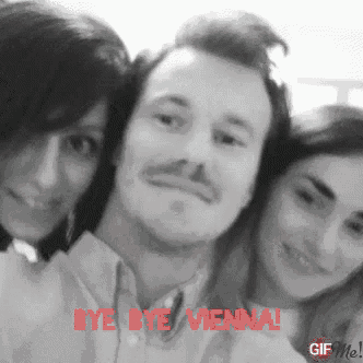 a black and white photo of a man and two women with the words bye bye vienna written in red