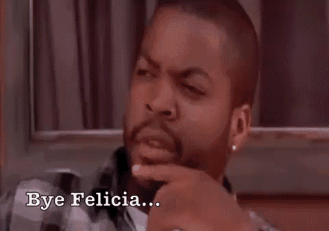 ice cube is sitting in front of a window with his hand on his chin .
