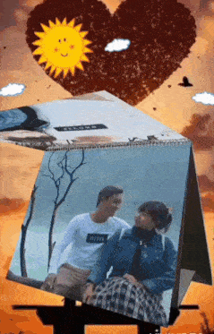 a picture of a man and a woman sitting next to each other in front of a heart shaped sun .