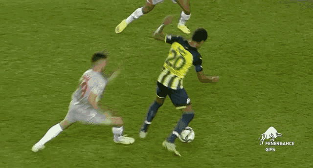 a soccer player with the number 20 on his jersey is being tackled by another player